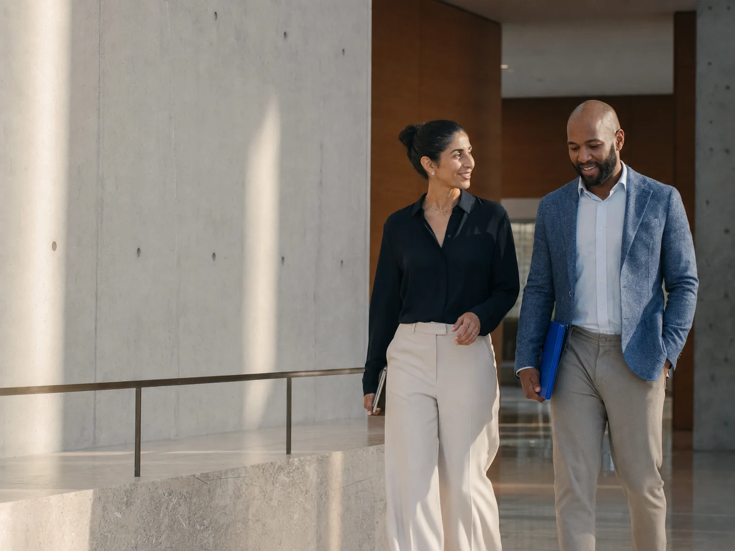 Two operations leaders walking through a contemporary workplace
